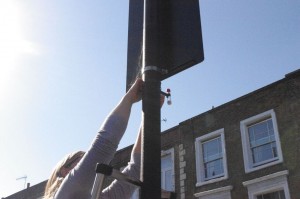 Community member installing a diffusion tube in Highbury, North London